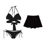 Load image into Gallery viewer, Black bikini set with a matching skirt on a white background
