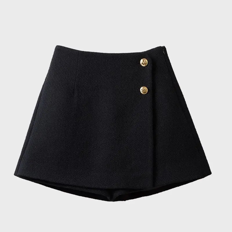Black skirt with gold buttons on a light gray background