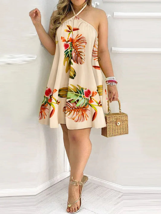 Woman wearing a floral dress holding a small handbag against a white background