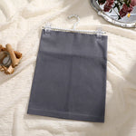 Load image into Gallery viewer, Gray apron on a hanger with a decorative background
