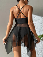 Load image into Gallery viewer, Person wearing a black strappy dress with sheer overlay against a neutral background
