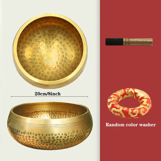 Two gold singing bowls with a washer on a red background
