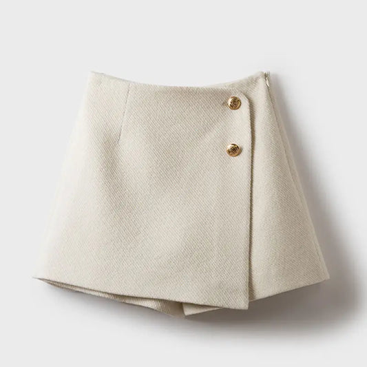 Beige skirt with gold buttons on a white background