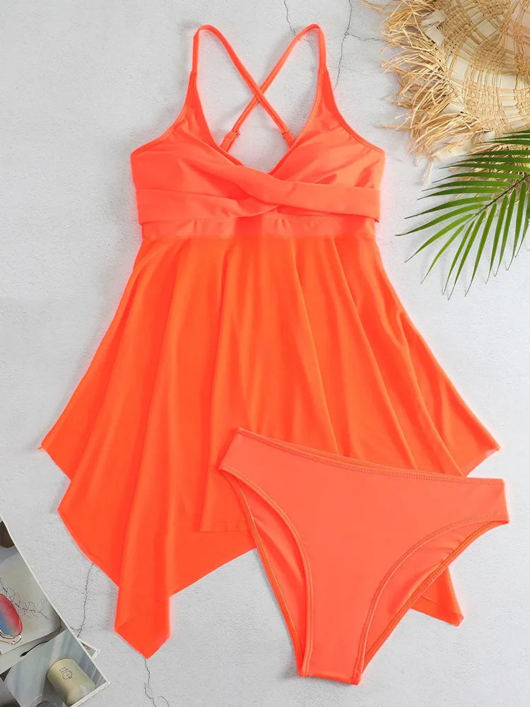 Neon orange swimsuit with a matching cover-up on a light gray background.