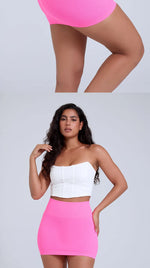 Load image into Gallery viewer, Woman wearing a white top and pink skirt on a plain background
