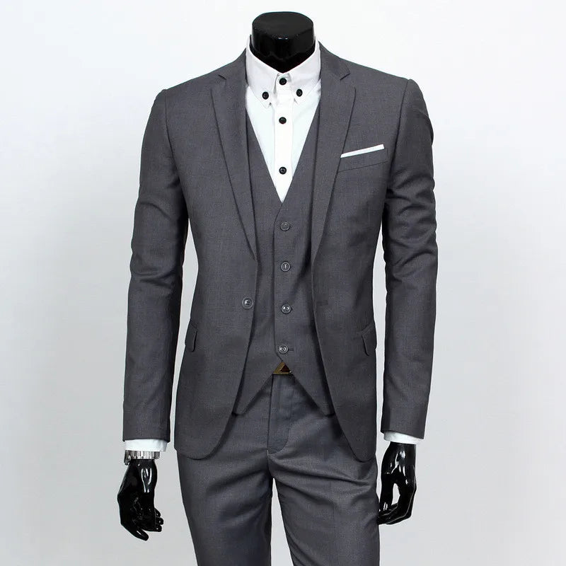 Gray suit with white shirt and black gloves on a mannequin against a white background