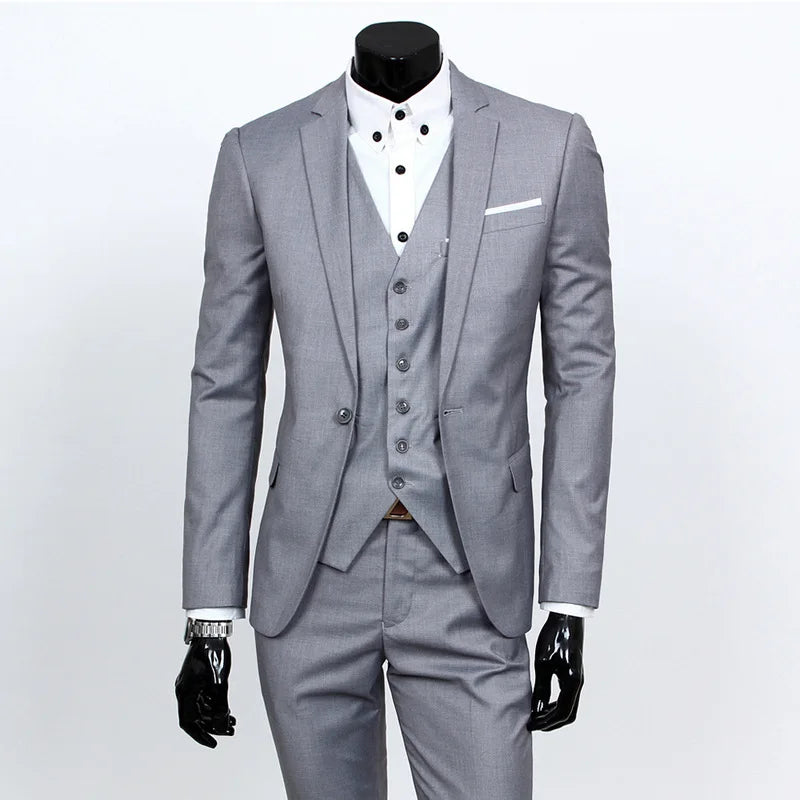 Gray suit on a mannequin with a white shirt and black bow tie against a light gray background