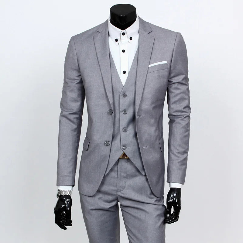 Gray suit on a mannequin with a white shirt and black gloves on a light gray background