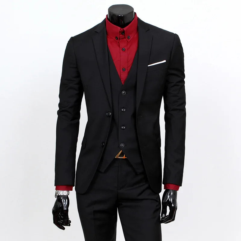 Black suit with red shirt on a mannequin against a white background